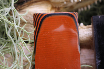 Knife Handle Pair Black and Burnt Orange G10 approximately 6.25x 2 x .25