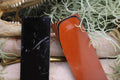 Knife Handle Pair Black and Burnt Orange G10 approximately 6.25x 2 x .25