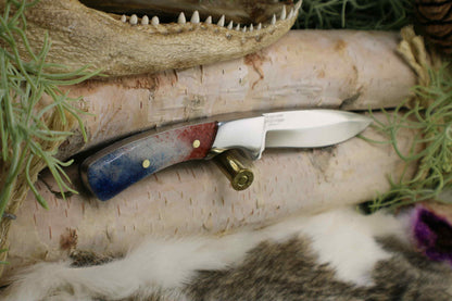 Completed Drop point hunter with Red White and Blue resin handle